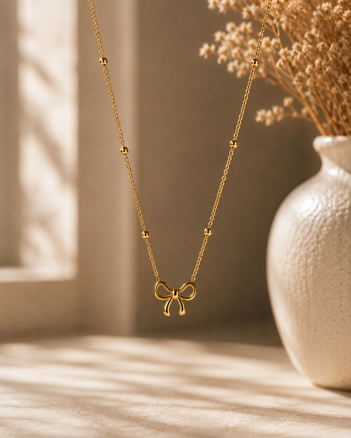 The Bow Charm Gold Necklace